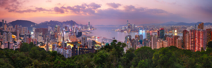 Obraz premium Hong Kong cityscape with skyscrapers at sunset, panorama