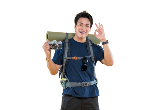 A smiling hiker is ready for an adventure, carrying a camera, backpack, and sleeping mat. The hiker gives an 'okay' hand gesture while on png background.