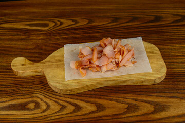 beer appetizer dried chicken on a wooden board on the background