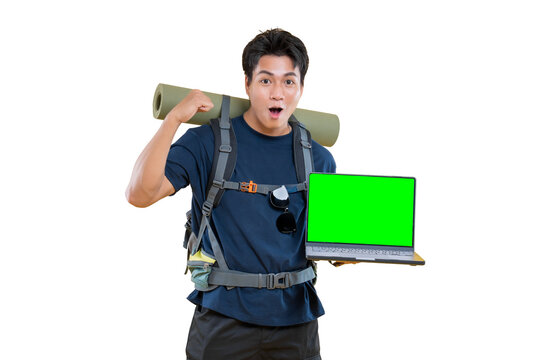 A young traveler amazed with a laptop in his hand, showcasing a green screen on png background