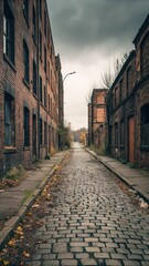 An old cobblestone street lined with weathered brick buildings under a moody sky