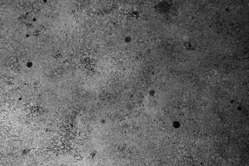 Grunge concrete wall in black and white with aged texture and spots