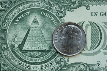 American cent coin on dollar bill close up. United States currency