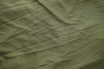 Background texture of camouflage khaki green color military uniform fabric