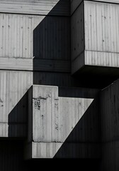 Abstract geometric concrete structure with strong shadows creating bold architectural shapes