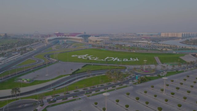 Dubai, United Arab Emirates - 01 August 2025: Aerial view of the Yas Marina Circuit, where the race track meets the city's landscape.