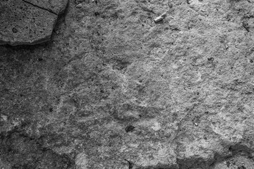 Cracked concrete with green moss for concepts of erosion, decay and natural textures