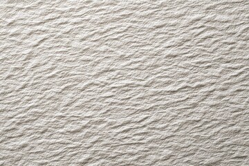 Close-up of textured beige fabric with creases and shadows