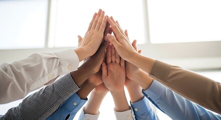 Upward Perspective Diverse Hands Stacked in Unity and Collaboration Gesture