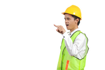 Asian construction worker wearing a yellow hard hat and safety vest, professionally pointing to something on a white background