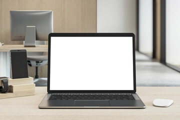 Blank laptop screen mockup on wooden desk in modern office with tech accessories and clean minimalist workspace setup in front view perspective. 3D Rendering