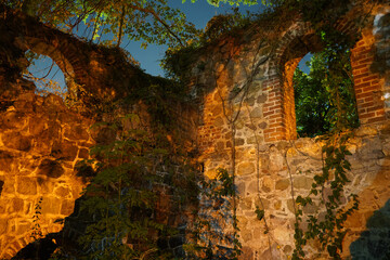 Weathered ruins of an old structure, showing decay, history, and forgotten beauty.