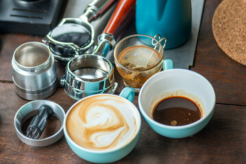 Barista Training Setup with Complete Latte Art Tools and Espresso Preparation Elements on Wooden Surface Coffee Tools Flat Lay: Organized Portafilter, Milk Jug, and Cups for Specialty Coffee.