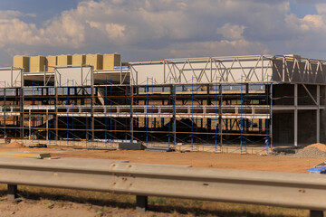 Construction of buildings, a multi-story building against the sky © Kozlik_mozlik