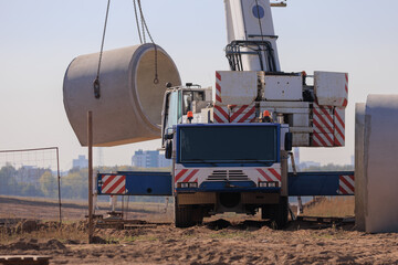 Construction of buildings and high-rise cranes against the blue sky