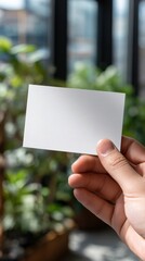 Blank Business Card Mockup in Hand - Green Background