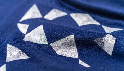Indigo blue fabric with a repeating pattern of white triangles
