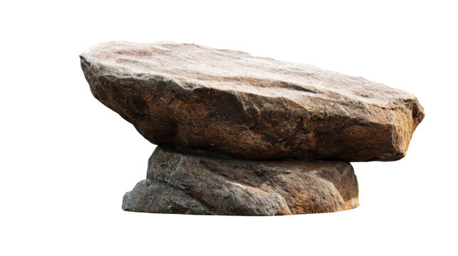 A large, flat stone balanced on top of a smaller rock, showcasing natural textures and colors.