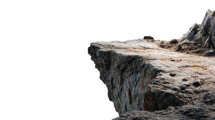 A rugged rock formation with a textured surface, set against a stark black background, emphasizing its natural contours and ruggedness.