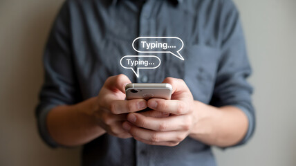 Person texting on a smartphone with chat bubbles above