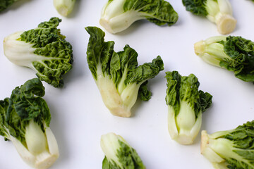Fresh baby bok choy with crisp white green leaves.