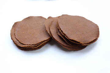 Fermented soybean discs, known as “Thua Nao,” a traditional Thai seasoning used to enhance flavor in Northern cuisine.