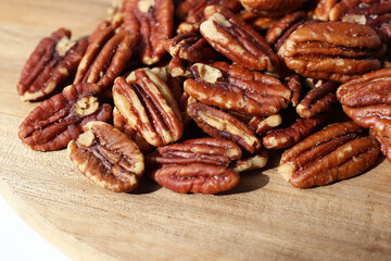 Delicious salted pecan nuts scattered.