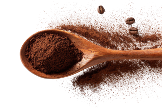 Wooden spoon holding cocoa powder over sugar and coffee beans