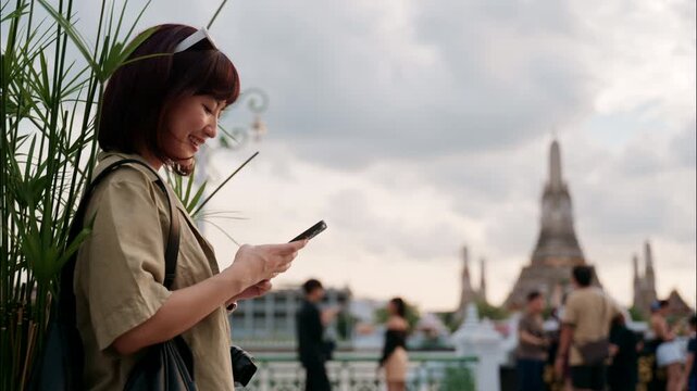 Happy young asian woman experiencing cultural world travel journey in Bangkok, Thailand. solo female tourist explores famous temple landmark with joyful smile - Powered by Adobe