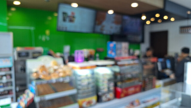 defocused abstrack background of cashier of minimarket or convenience store. Grocery shopping concept