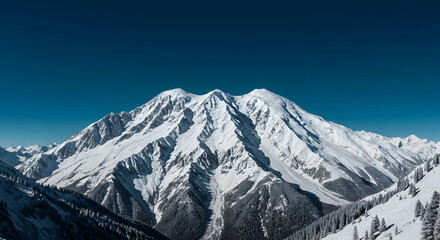 Obraz premium Majestic Snowy Mountain Peak under a Clear Blue Sky
