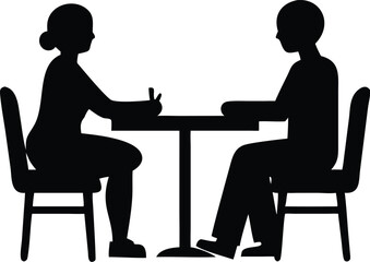 two people sitting at a table silhouette
