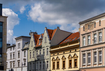 Historic tenement houses in the center of Bydgoszcz, with decorative facades and red-tiled roofs.