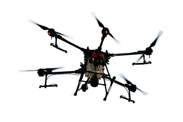 Agricultural technology smart farm concept. Farmer technicians remotely fly agricultural drones to fly to spray fertilizer in fields.