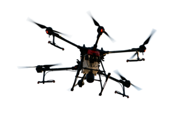 Agricultural technology smart farm concept. Farmer technicians remotely fly agricultural drones to fly to spray fertilizer in fields.