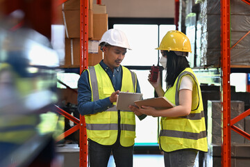 Team discussing warehouse management, safety compliance, and workflow optimization using digital tools for real-time supervision