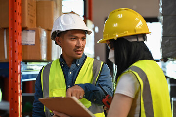 An Aggressive Supervisor reviewing operational errors with a staff member during a warehouse inspection for process improvement and quality assurance