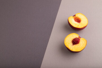 Peach Cut in half on black and gray paper pastel, Side view, copy space