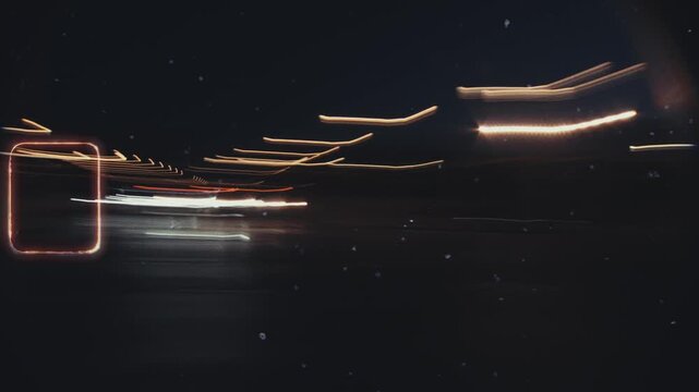 Light trails and city lights blur on super 8 film