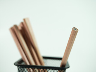 Pencils in a wire mesh holder, perfect for creative projects, education, and design inspiration