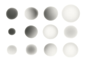 A gradient array of uniformly blurred spheres displayed in varying shades of gray against a white background, showcasing a smooth transition of tones and shadows.
