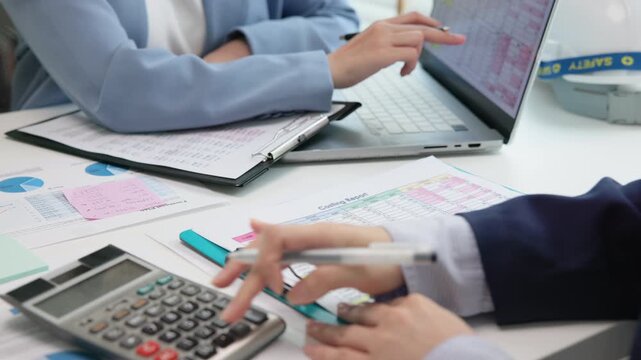 Expert woman asian female people review data number costing managerial account prepare monthly actual cost variance report income tax at audit office. ESG budget control ERP process service project.