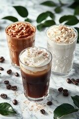 Three iced coffee drinks with whipped cream and chocolate on a white marble background

