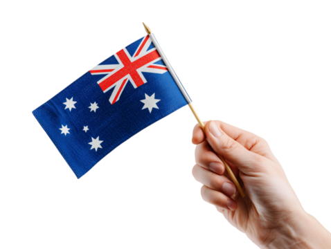 A person's hand confidently holds the Australian flag, its iconic design proudly displayed