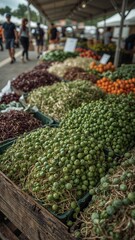 Close up of produce at an outdoor market with people browsing in the blurred background view here now