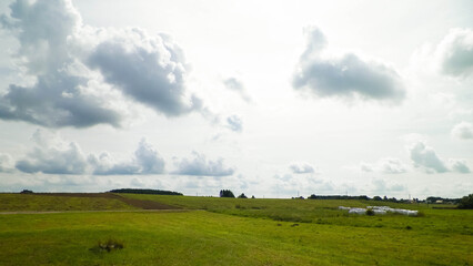 Obraz premium Green field in the Kashubian countryside. Poland.