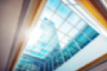 A blurred, abstract view of a skylight in a modern shopping mall in Shenzhen, China, with bokeh effects.