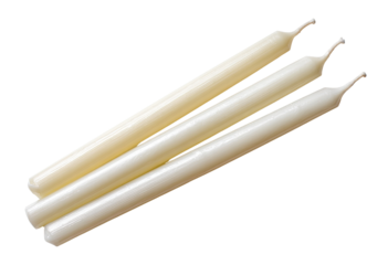 Three off-white taper candles arranged in a slightly overlapping, diagonal position