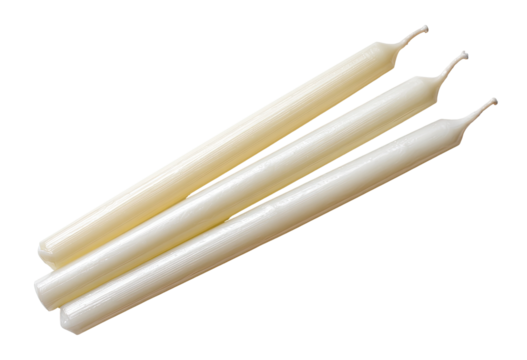 Three off-white taper candles arranged in a slightly overlapping, diagonal position