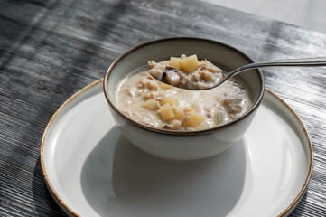 A bowl of creamy mushroom soup in a cafe. 